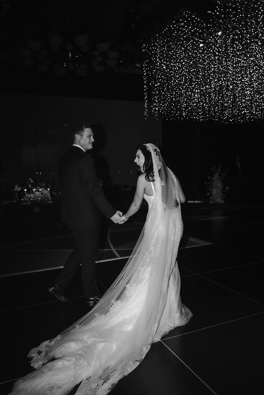 Bride and groom walking together during Crown Perth wedding reception