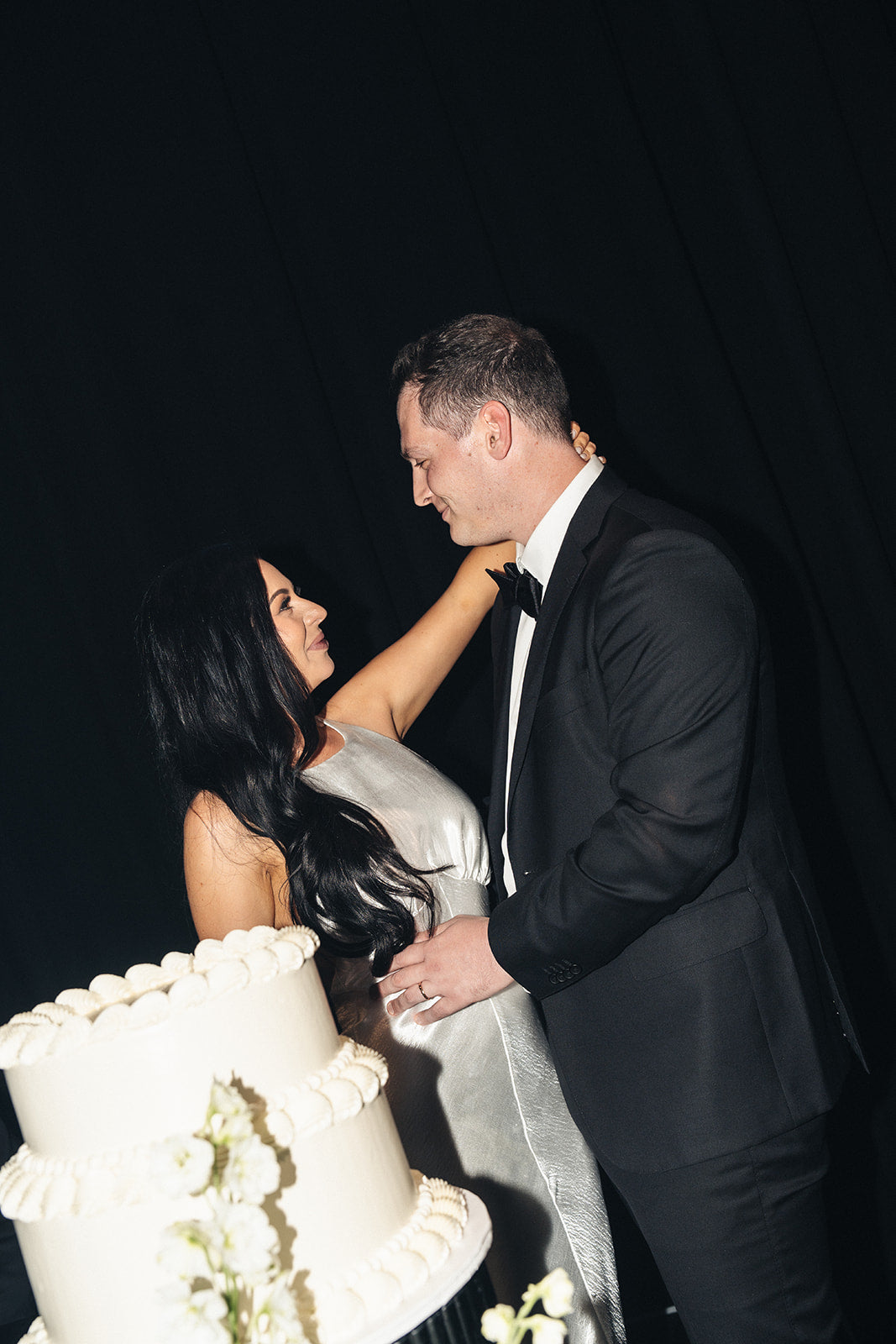 Bride and groom cutting wedding cake at Crown Perth
