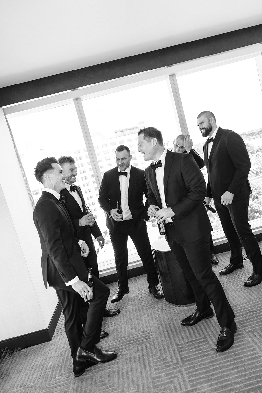 Groom and groomsmen preparing together at Crown Perth wedding
