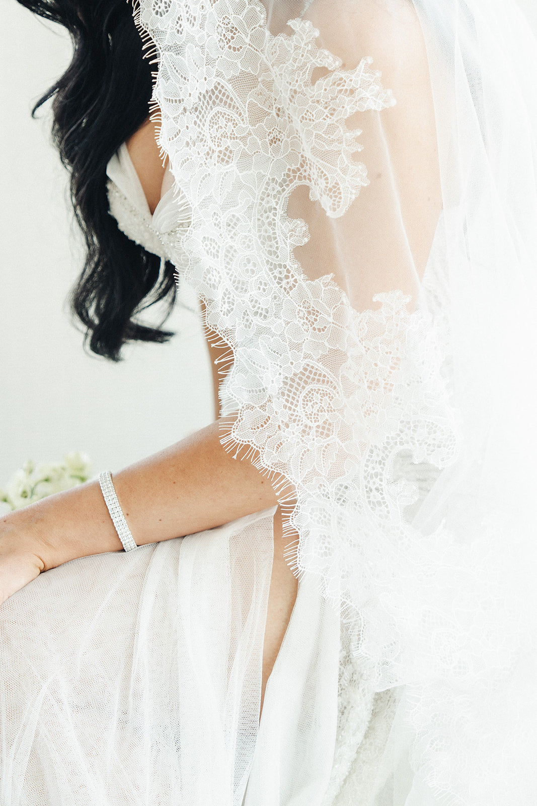Bridal gown lace detail during Crown Perth wedding preparations
