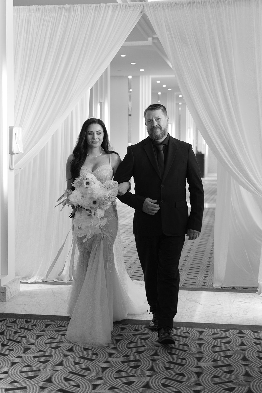 Bride walking down the aisle with her father at Crown Perth wedding