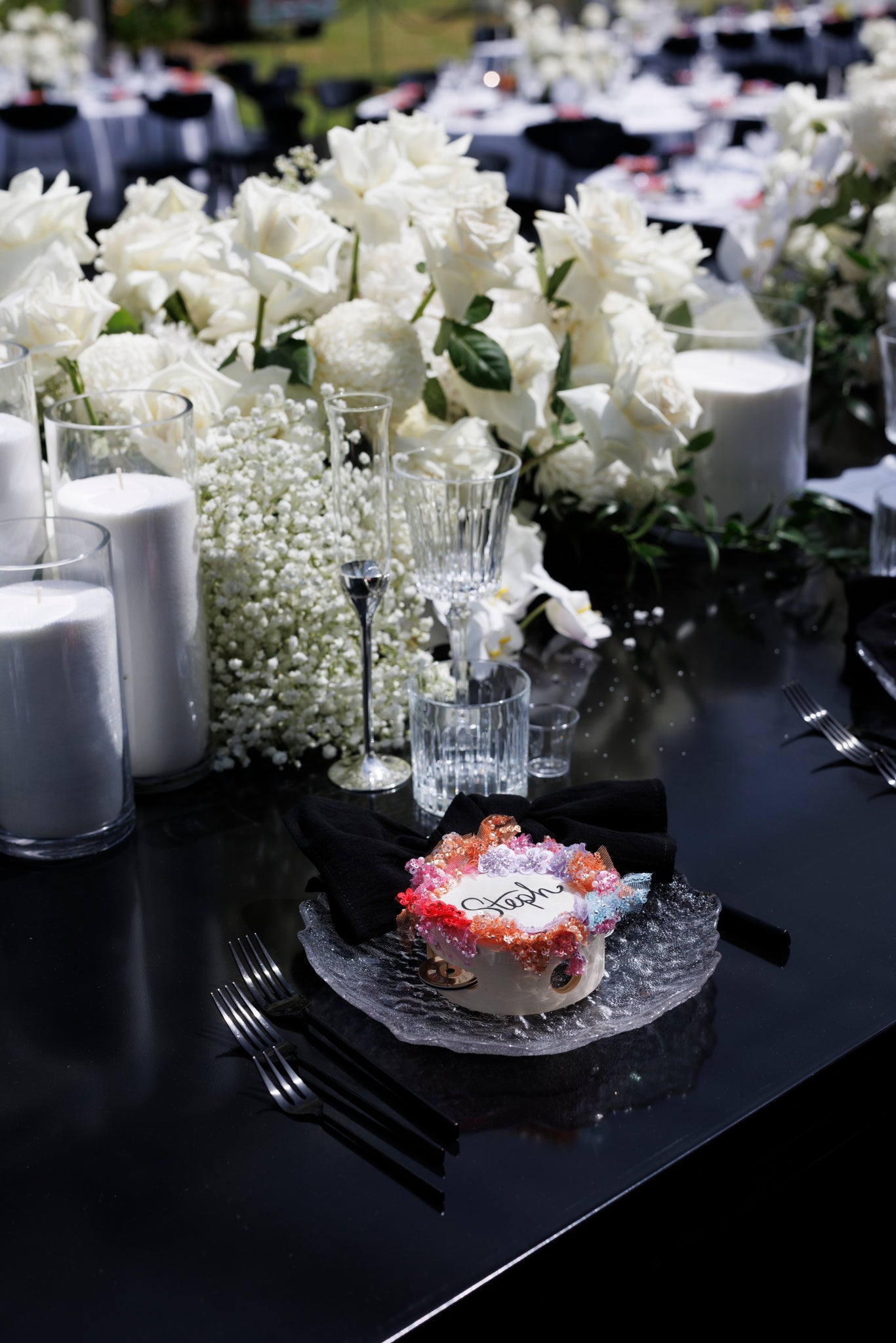 Candlelit table styling with grapes and dark-toned Italian-inspired décor.